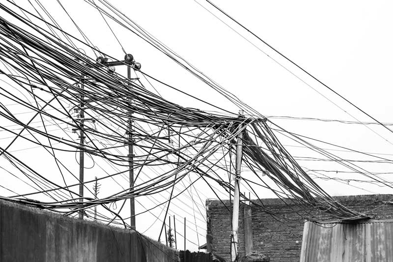 In the absence of exclusive supporting structures, water cables in Kohima, Nagaland are laid over telephone and electricity poles along the roads, the heavy load of the water damaging the poles and posing considerable risk of electric shock